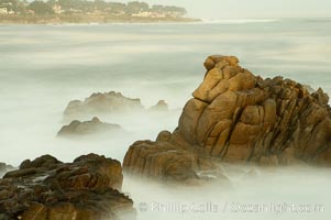 Waves breaking over rocks appear as a foggy mist in this time exposure.  Pacific Grove, Lovers Point