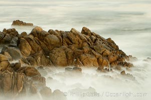 Waves breaking over rocks appear as a foggy mist in this time exposure.  Pacific Grove, Lovers Point