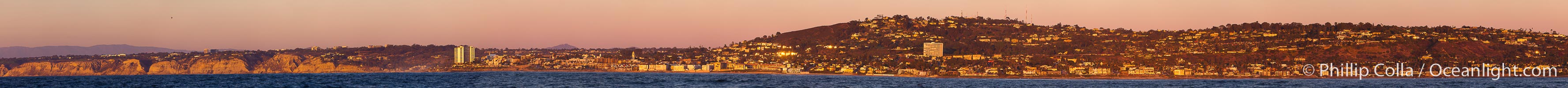 Panorama of La Jolla, with Mount Soledad aglow at sunset, viewed from the Pacific Ocean offshore of San Diego