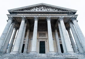 Pantheon. The Pantheon is a building in the Latin Quarter in Paris. It was originally built as a church dedicated to St. Genevieve and to house the reliquary chasse containing her relics but now functions as a secular mausoleum containing the remains of distinguished French citizens