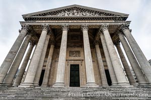 Pantheon. The Pantheon is a building in the Latin Quarter in Paris. It was originally built as a church dedicated to St. Genevieve and to house the reliquary chasse containing her relics but now functions as a secular mausoleum containing the remains of distinguished French citizens.