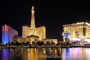 Image 20577, The half-scale replica of the Eiffel Tower at the Paris Hotel in Las Vegas is reflected in the Bellagio Hotel fountain pool at night. Nevada, USA, Phillip Colla, all rights reserved worldwide. Keywords: las vegas, las vegas at night, nevada, paris hotel, usa.
