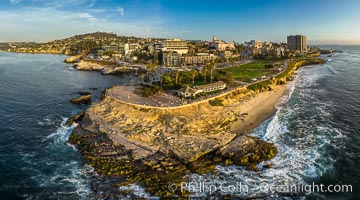 Point La Jolla and Scripps Park aerial photo, sunset, sea lions and sea gulls and tourists looking down on Boomer Beach. Aerial panoramic photo