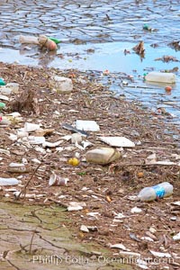 Pollution accumulates in the Tijuana River Valley following winter storms which flush the trash from Tijuana in Mexico across the border into the United States, Imperial Beach, San Diego, California