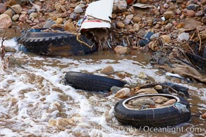 Pollution accumulates in the Tijuana River Valley following winter storms which flush the trash from Tijuana in Mexico across the border into the United States, Imperial Beach, San Diego, California