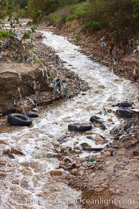 Pollution accumulates in the Tijuana River Valley following winter storms which flush the trash from Tijuana in Mexico across the border into the United States, Imperial Beach, San Diego, California