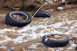 Pollution accumulates in the Tijuana River Valley following winter storms which flush the trash from Tijuana in Mexico across the border into the United States, Imperial Beach, San Diego, California