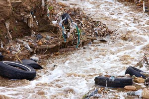 Pollution accumulates in the Tijuana River Valley following winter storms which flush the trash from Tijuana in Mexico across the border into the United States, Imperial Beach, San Diego, California