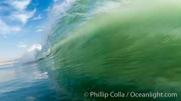 Sunset wave, breaking surf backlit before night, Ponto, Carlsbad.