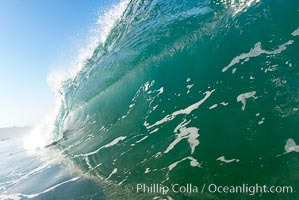 Green ocean water and breaking surf.