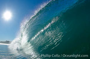 Cresting wave and morning sun, Carlsbad, California.