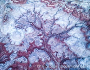 Pre-Dawn over the Tree of Eons, Utah. The Tree of Eons is a spectacular geologic sight near the San Rafael Swell.  Erosion has cut a "tree" through red, blue, purple and white layers of the Chinle formation. The Tree of Eons is a superb example of dendritic erosion and to really appreciate the complex fractal-like details it must be observed from above.  Photographed here in the soft, predawn light, it takes on magenta, red and purple hues just before the sun reaches it. Aerial panoramic photograph