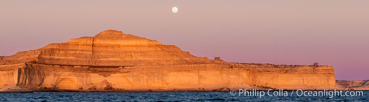 The Pyramid for which Puerto Piramides was named, with full moon rising as the sun sets. Patagonia