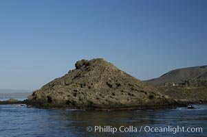 China Hat Point, a prominent feature along the rugged coastline of San Clemente Island at Pyramid Cove, near the islands southeastern tip.  San Clemente Island is used as a US Navy bombing target