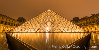 The Louvre Pyramid, Pyramide du Louvre,  large glass and metal pyramid in the main courtyard (Cour Napoleon) of the Louvre Palace (Palais du Louvre) in Paris, Musee du Louvre