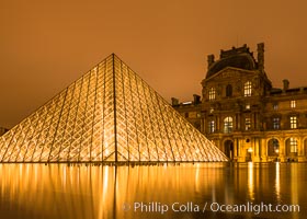 The Louvre Pyramid at Night, Pyramide du Louvre,  large glass and metal pyramid in the main courtyard (Cour Napoleon) of the Louvre Palace (Palais du Louvre) in Paris
