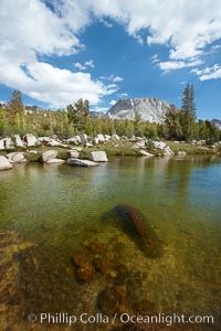 Rafferty Creek, flows under blue skies, on approach to Vogelsang High Sierra Camp.  Vogelsang Peak is seen in the distance, Yosemite National Park, California