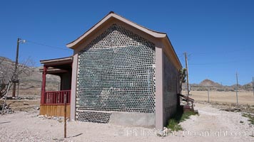 The strange "bottle house" of Rhyolite ghost town, near Death Valley. It was built in 1906 by Tom Kelley of approximately 50,000 beer bottles and was his home for a while. Nevada, USA, natural history stock photograph, photo id 20588