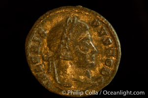 Roman emperor Crispus (316-326 A.D.), depicted on ancient Roman coin (bronze, denom/type: AE3) (AE3. Reverse: C, AESRVM NOSTRORVM. Wreath enclosing VOT V.)