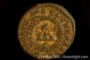 Roman emperor Crispus (316-326 A.D.), depicted on ancient Roman coin (bronze, denom/type: AE3) (AE3. Reverse: C, AESRVM NOSTRORVM. Wreath enclosing VOT V.)