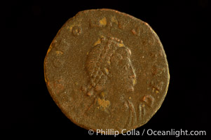 Roman emperor Honorius (393-423 A.D.), depicted on ancient Roman coin (bronze, denom/type: AE2) (AE2. Obverse: D.N.HONORIUS.PF.AVG. Reverse: GLORIA.ROMAN.ORVM. Honorius standing, facing right holding standard and globe.)