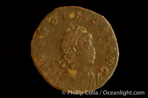 Roman emperor Honorius (393-423 A.D.), depicted on ancient Roman coin (bronze, denom/type: AE2) (AE2. Obverse: D.N.HONORIUS.PF.AVG. Reverse: GLORIA.ROMAN.ORVM. Honorius standing, facing right holding standard and globe.)