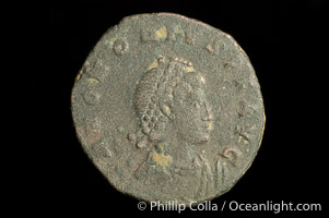 Roman emperor Honorius (393-423 A.D.), depicted on ancient Roman coin (bronze, denom/type: AE2) (AE2. Obverse: D.N.HONORIUS.PF.AVG. Reverse: GLORIA.ROMAN.ORVM. Honorius standing, facing right holding standard and globe.)