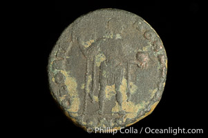 Roman emperor Honorius (393-423 A.D.), depicted on ancient Roman coin (bronze, denom/type: AE2) (AE2. Obverse: D.N.HONORIUS.PF.AVG. Reverse: GLORIA.ROMAN.ORVM. Honorius standing, facing right holding standard and globe.)