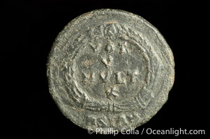 Roman emperor Jovian (363-364 A.D.), depicted on ancient Roman coin (bronze, denom/type: AE3) (AE3. nVF. Reverse: legend in wreath VOT V MVLT X.3.)