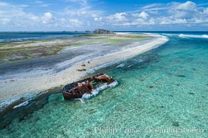 Rusting shipwreck on the beach at Clipperton Island, aerial photo, Clipperton Island is a spectacular coral atoll in the eastern Pacific. By permit HC / 1485 / CAB (France)