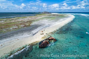 Rusting shipwreck on the beach at Clipperton Island, aerial photo, Clipperton Island is a spectacular coral atoll in the eastern Pacific. By permit HC / 1485 / CAB (France)