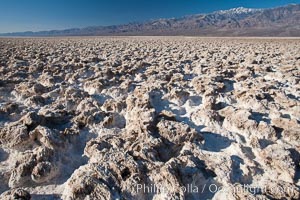 Devils Golf Course, California.  Evaporated salt has formed into gnarled, complex crystalline shapes in on the salt pan of Death Valley National Park, one of the largest salt pans in the world.  The shapes are constantly evolving as occasional floods submerge the salt concretions before receding and depositing more salt