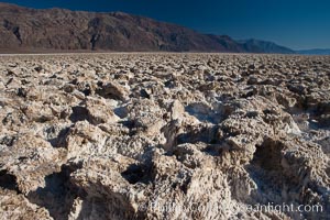 Devils Golf Course, California.  Evaporated salt has formed into gnarled, complex crystalline shapes in on the salt pan of Death Valley National Park, one of the largest salt pans in the world.  The shapes are constantly evolving as occasional floods submerge the salt concretions before receding and depositing more salt