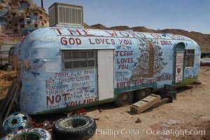 Salvation Mountain, near the desert community of Slab City and the small town of Niland on the east side of the Salton Sea.  Built over several decades by full-time resident Leonard Knight, who lives at the site, Salvation Mountain was built from over 100,000 gallons of paint, haybales, wood and metal and was created by Mr. Knight to convey the message that "God Loves Everyone"