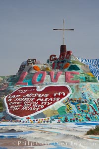 Salvation Mountain, near the desert community of Slab City and the small town of Niland on the east side of the Salton Sea.  Built over several decades by full-time resident Leonard Knight, who lives at the site, Salvation Mountain was built from over 100,000 gallons of paint, haybales, wood and metal and was created by Mr. Knight to convey the message that "God Loves Everyone"