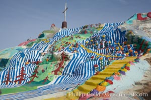 Salvation Mountain, near the desert community of Slab City and the small town of Niland on the east side of the Salton Sea.  Built over several decades by full-time resident Leonard Knight, who lives at the site, Salvation Mountain was built from over 100,000 gallons of paint, haybales, wood and metal and was created by Mr. Knight to convey the message that "God Loves Everyone"