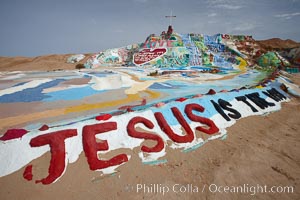 Salvation Mountain, near the desert community of Slab City and the small town of Niland on the east side of the Salton Sea.  Built over several decades by full-time resident Leonard Knight, who lives at the site, Salvation Mountain was built from over 100,000 gallons of paint, haybales, wood and metal and was created by Mr. Knight to convey the message that "God Loves Everyone"