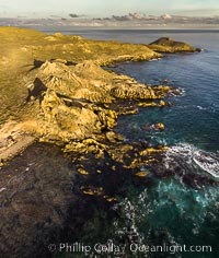 San Clemente Island aerial photo, Pyramid Head and Balanced Rock at the southern end of the island.  San Clemente Island Pyramid Head, the distinctive pyramid shaped southern end of the island, exhibits distinctive geologic terracing, underwater reefs and giant kelp forests