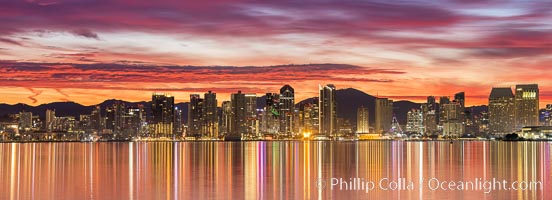 San Diego Bay and Downtown City Skyline at Dawn, spectacular clouds light up over the city. Mount San Miguel in the distance.