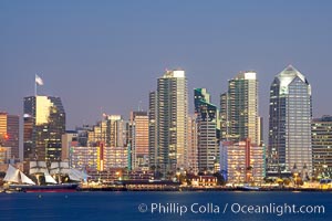 San Diego city skyline at dusk, viewed from Harbor Island, the Star of India at left