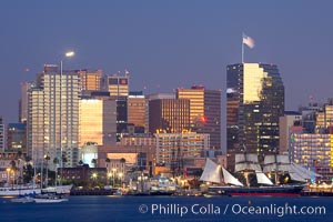 San Diego city skyline at dusk, viewed from Harbor Island, the Star of India at right