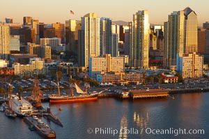 San Diego waterfront and skyline, Star of India (lower left), high rise modern office buildings, San Diego Bay, sunset