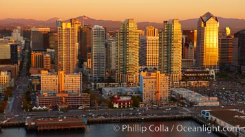 San Diego Skyline at sunset, North Harbor Drive running along the waterfront, high rise office buildings, with cruise ship terminal (right).