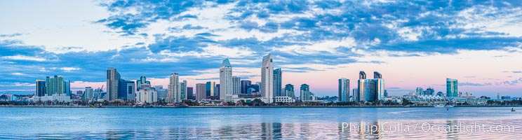 San Diego city skyline, dusk, clearing storm clouds