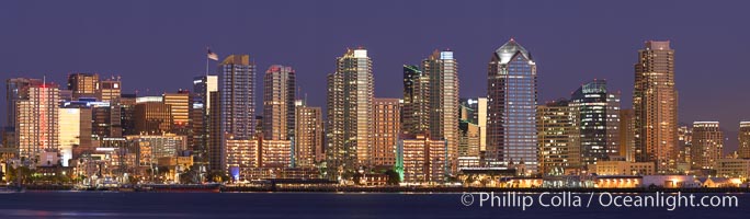 San Diego city skyline at sunset, showing the buildings of downtown San Diego rising above San Diego Harbor, viewed from Harbor Island.  A panoramic photograph, composite of thirteen separate images.