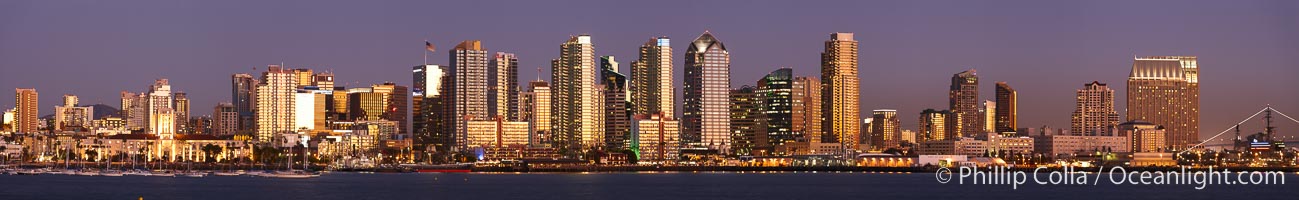 San Diego city skyline at sunset, showing the buildings of downtown San Diego rising above San Diego Harbor, viewed from Harbor Island.  A panoramic photograph, composite of six separate images