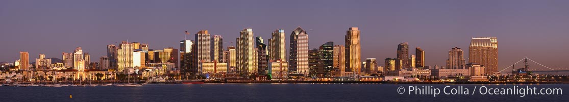 San Diego city skyline at sunset, showing the buildings of downtown San Diego rising above San Diego Harbor, viewed from Harbor Island.  A panoramic photograph, composite of six separate images