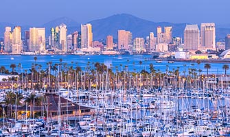 San Diego City Skyline at Sunset, viewed from Point Loma, Shelter Island Yacht Club in the foreground, San Diego Bay, Mount San Miguel (right) and Lyons Peak (left) in distance