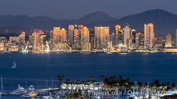 San Diego City Skyline at Sunset, viewed from Point Loma, panoramic photograph. The mountains east of San Diego can be clearly seen when the air is cold, dry and clear as it is in this photo. Lyons Peak is in center and Mount San Miguel to the right