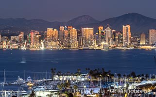 San Diego City Skyline at Sunset, viewed from Point Loma, panoramic photograph. The mountains east of San Diego can be clearly seen when the air is cold, dry and clear as it is in this photo. Lyons Peak is in center and Mount San Miguel to the right